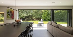 A modern home with a sliding door, creating the perfect indoor, outdoor space.